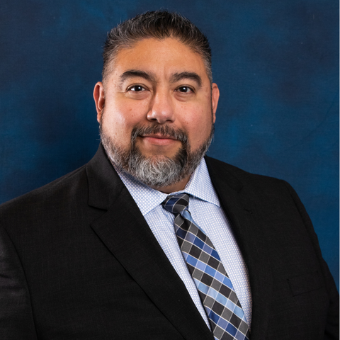 Headshot of COTPA Board Trustee Robert Ruiz on blue background.